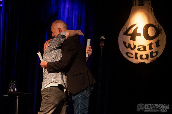 Mayor Kelly Girtz presents Patton Oswalt with key to city