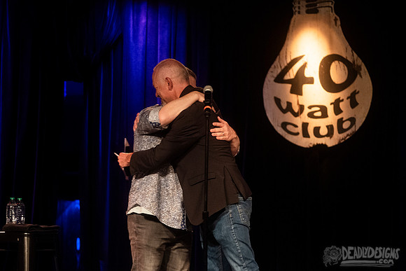 Mayor Kelly Girtz presents Patton Oswalt with key to city