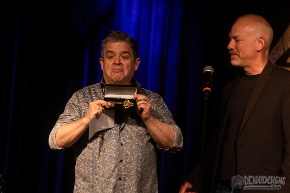 Mayor Kelly Girtz presents Patton Oswalt with key to city